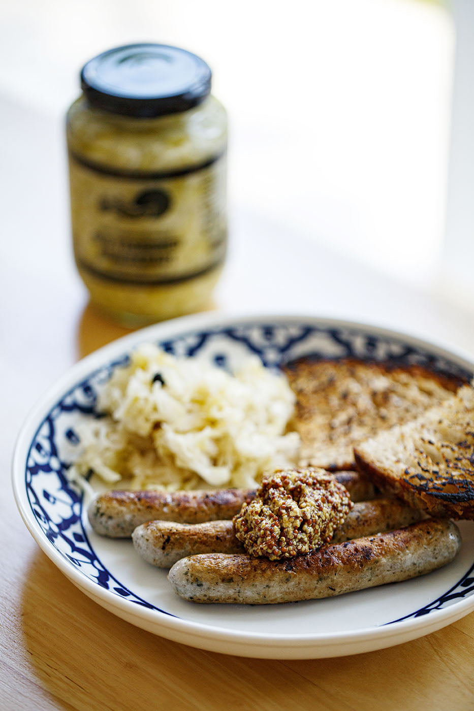 Choucroute and sausage dish with sauerkraut jar