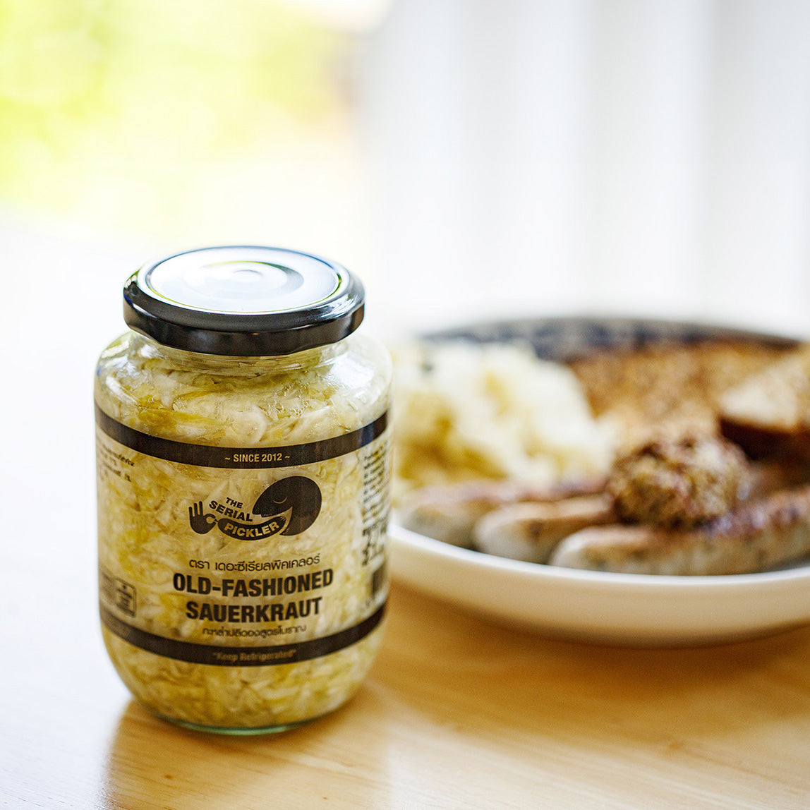 Sauerkraut jar and sausage with choucroute dish
